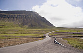 Windy road around brjanslaekur in the North West Fjords  Empty road on a summer day  Iceland
