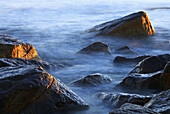 Sunrise, Waves on Rocks, Cape Cod Bay.Town Neck Beach. Sandwich, Cape Cod. Massachusetts, USA