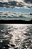 Lake Saimaa reflecting the light of the sun, Saimaa Lake District, Finland, Europe