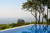 View from the pool of the Popa Mountain Resort to Popa Taung Kalat, a monastery on the volcano Mount Popa, Myanmar, Burma, Asia