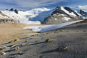 Icemaker Mountain left 2745 m 9006 ft and Mount Guthrum 2695 m 8842 ft seen from pumice covered slopes above Athelney Pass, Coast Mountains British Columbia Canada