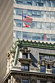 American flag on the top of building, New York City, USA