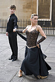 A young ballroom dance pair performing on the street