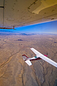 Two Desert Air Cessna 210s fly above the Namib Desert, Namibia