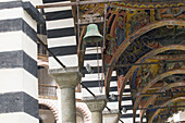 Rila monastery, arcades with ceiling frescos in front of Mary`s Birth Church, Bulgaria
