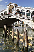 View of moorings and the Rialto Bridge, Sestière di San Marco, Venice, Veneto, Italy