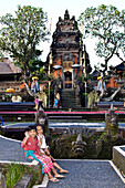 Twi little girl friends at temple in  Ubud , Bali Indonesia