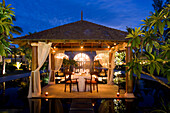 Resort Moevenpick at twilight, luxery table in small pavillion, sunset,  south coast of  Mauritius, Africa