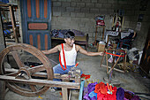 GUATEMALA  Rolando Sicajan Perez, 23, preparing thread for weaving   Santa Catarina Palopo, on Lake Atitlan