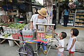 PHILIPPINES  Ice cream seller   Scene in a street market at Bagong Silangan, Quezon City, Manila