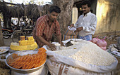 9324  INDIA  Selling rice at a  market in a village near Mulbaghal, Karnataka