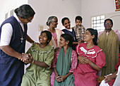 9896  INDIA  Sisters Leela and Achama greeting patients, SSSMILE village, Kerala