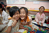 Cambodia  Childrens Center at Anlon Kgnan  Young children playing with toys