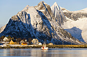 Fishing boat & Reine Village, Lofoten, Norway