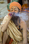 Sadhu with chillum pipe, Allahabad, Uttar Pradesh, India