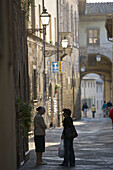 Two ladies talking in the street. Colle di Val dElsa. Tuscany. Italy