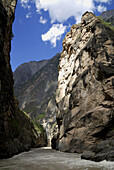 Tiger Leaping Gorge pinyin: Hutiào Xiá is a canyon on the Yangtze River - locally called the Golden Sands River, located 60 km north of Lijiang City, Yunnan in southwestern China