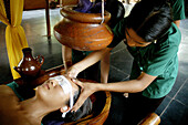Saligao Goa, India, a woman receiving an ayurvedic massage with oil at the Ayurvedic Natural Health Centre