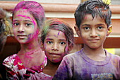 Panjim Goa, India, children with colored powder on the faces during the Holi feast