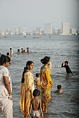 Mumbai India, people swimming at Chowpatty beach