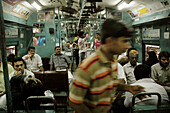 Mumbai India, passengers in a train at Victoria station