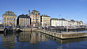 Skeppsbron quay in Stockholm, Sweden. The old town in the background.