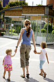 Woman and her two daughter at the mall