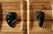 Dried chili pepper from Mexico in a wooden tray