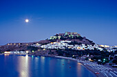 Full moon above acropolis and bay, Lindos, Island of Rhodes, Greece, Europe