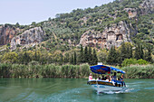 Excursion boat on the Dalyan river and Lycian Cliff Tombs, Dalyan River, Turkey, Europe