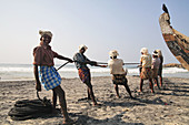 Working fisherman, Lighthouse beach, Kerala, India