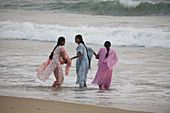 Women bathing at Lighthouse beach, Kerala, India