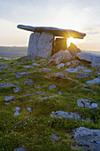 Poulabrone Megalithic Tomb with rising sun, Ireland