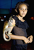 Jamaina Silva da Souza, in Jardim do Ouro, with her pet, a monkey that she found in the Amazonas riverside. Brazil.