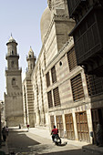 Al-Muizz li-Din Allah Street in Cairo & minarets of sultan Qalawun sultan al-Zahir barquq Madrasa & mosque. Egypt