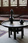 Table in room & windows (Mashrabiya) of old Arabic houses, Cairo, Egypt