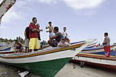 Group of fishermen and children in fishing boats, Playa El Tirano, Isla de Margarita, Nueva Esparta, Venezuela