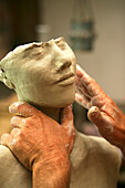view to the hands of an artist which shape a sculpture from clay, Richard Smith, Aptos, California, USA
