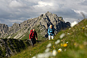 Couple hiking in the mountains, Tannheimer Mountains, Allgaeu Alps, Tirol, Austria, Europe