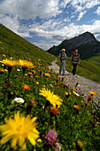 Couple hiking in the mountains, Tannheimer Mountains, Allgaeu Alps, Tirol, Austria, Europe