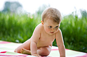 Naked baby on blanket, 9 months