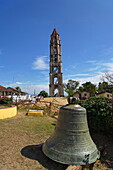 The tower at Manaca Iznaga estate, bell in foreground, Valle de los Ingenios, Trinidad, Sancti Spiritus, Cuba, West Indies