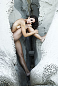 Adult, Body, Cave, Color, Colour, Feeling, Female, Formation, Good, Hidden, Hide, Human, Looking, Model, Natural, Nature, Nude, Nudity, Outdoors, Relax, Relaxing, Rock, Sexy, Shape, Vertical, Woman, Young, A75-807056, agefotostock 