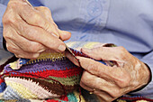 Old woman crocheting