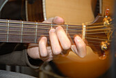 hands on a guitar