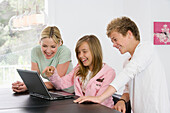 Adult, Adults, Amusement, At home, boy, Boy, boys, Boys, Brother, Brothers, Caucasian, Caucasians, Child, child, Children, children, Color, Colour, Computer, Computers, Contemporary, Daytime, Facial expression, Facial expressions, Female, female, Fun, Gir