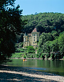 View over river to chateau, La Roque-Gageac, The Dordogne, France