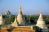 Monks & temple towers, Bagan, Burma