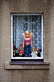 Doll in a window, Schwarzenberg, Ore mountains, Saxony, Germany