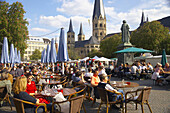 Pavement cafes, Bonn Minster in background, Bonn, North Rhine-Westphalia, Germany